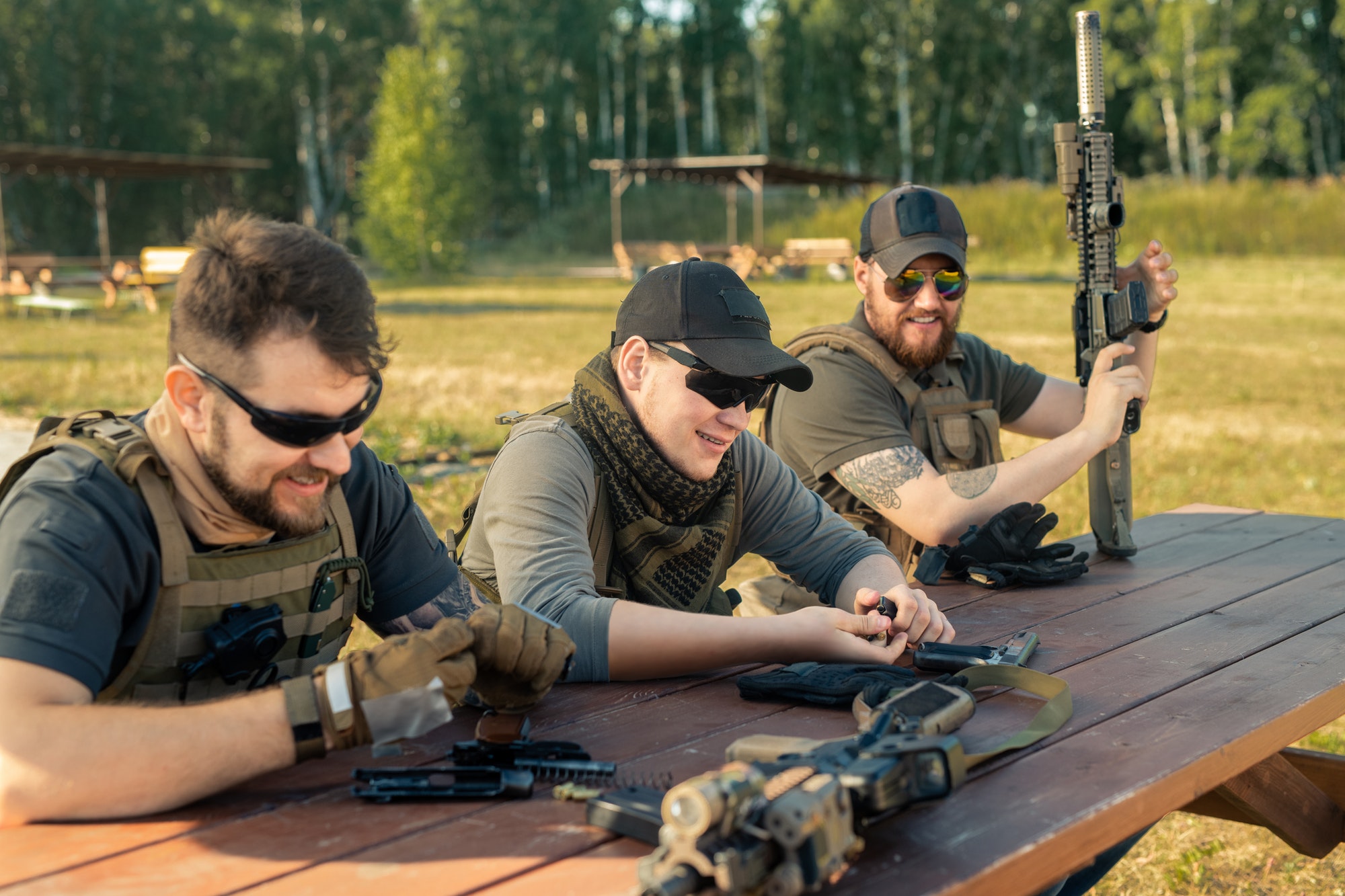 Men reloading guns